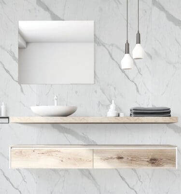 A modern bathroom setting infront of our Blanco Wall panel